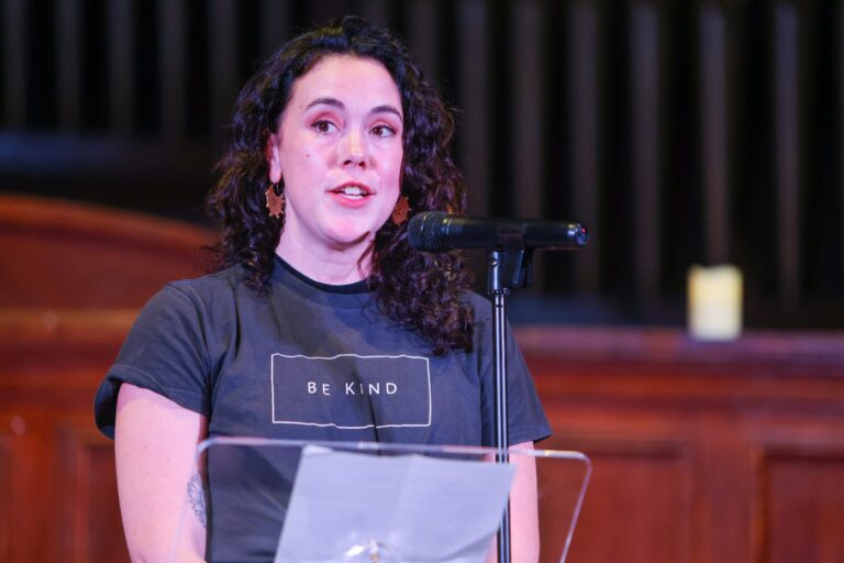 A speaker shares remarks at the microphone