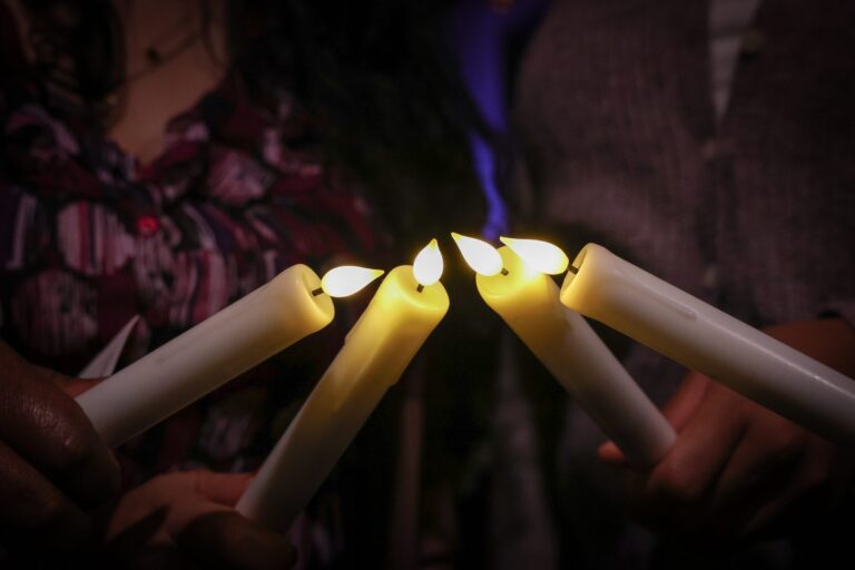 Close-up of candles held together during the candle lighting