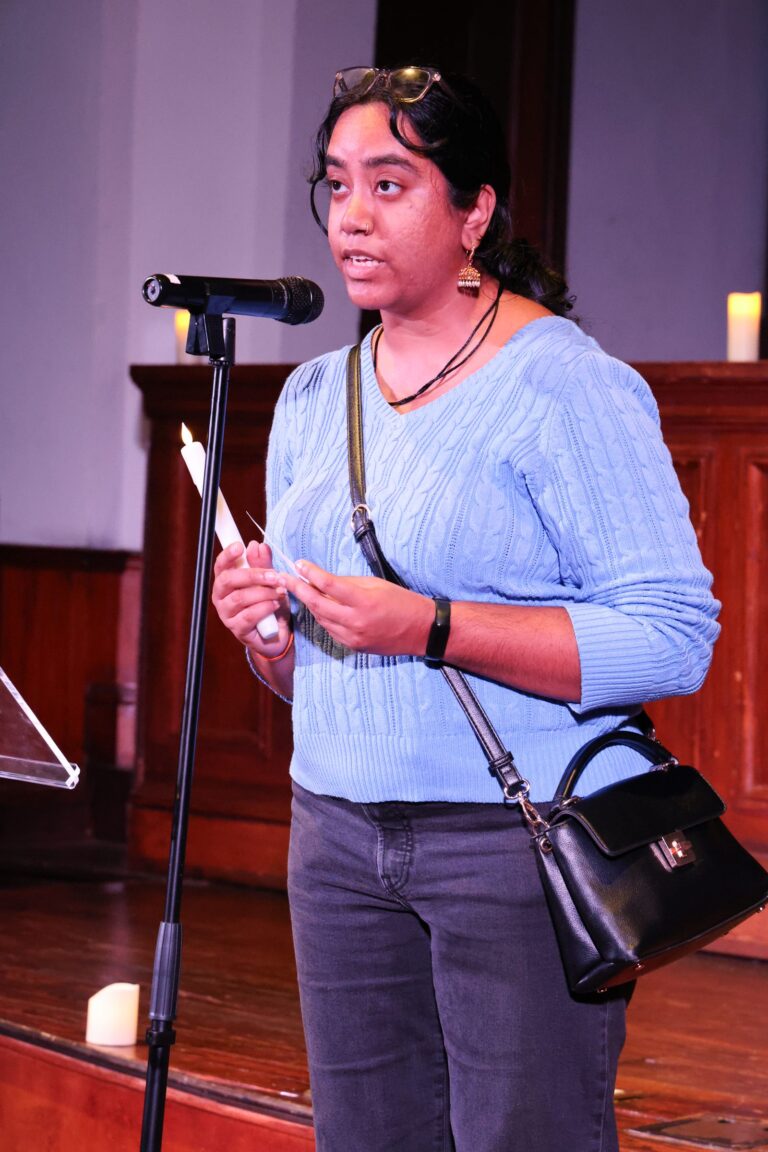 A speaker shares remarks at the microphone