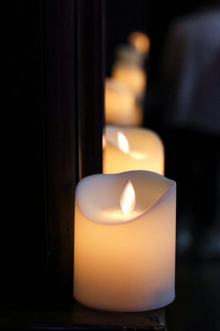 Candles glowing on a ledge