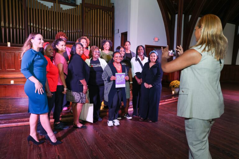 A group gathers for a photo after the vigil