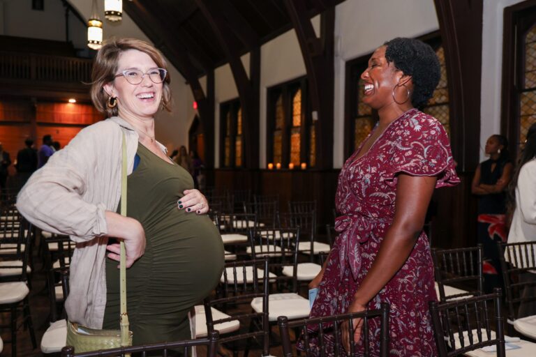 Attendees greet each other after the vigil
